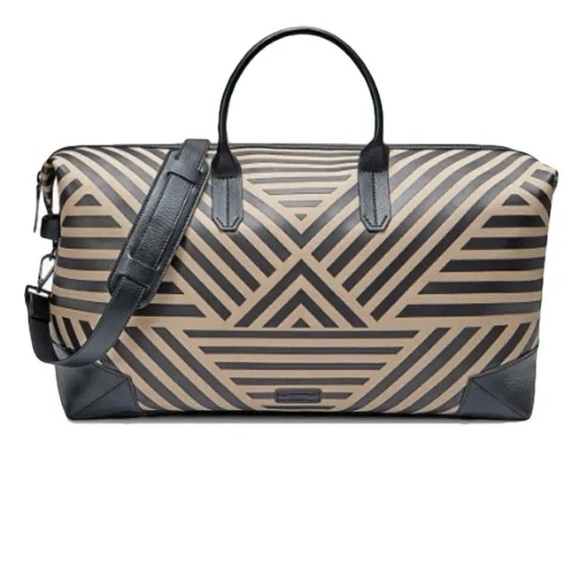 Uri Minkoff tan and black leather geometric design travel bag